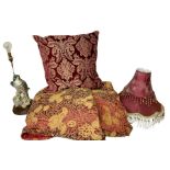 Quilted red and gold bedspread by Sandersons