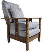 Arts & Craft oak reclining armchair with folding footstool