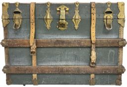 Early 20th century leather bound travelling trunk. teal leather exterior with oak strapping and gilt