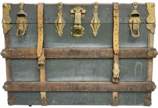 Early 20th century leather bound travelling trunk. teal leather exterior with oak strapping and gilt