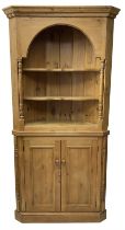 Waxed pine floor standing corner cupboard