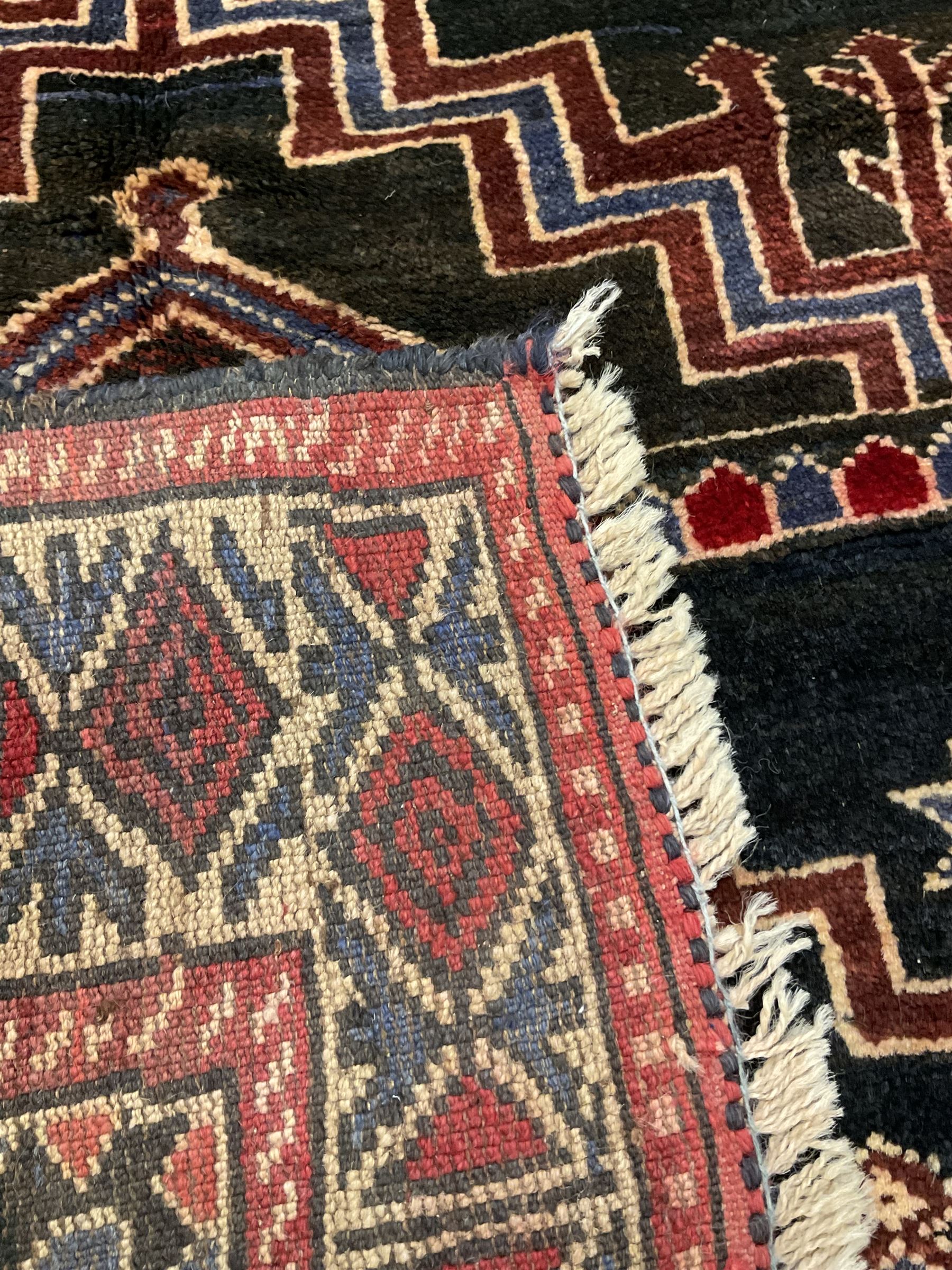 Baluchi dark indigo and crimson ground rug - Image 5 of 5