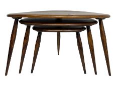 Ercol - mid-20th century stained elm and beech nest of three 'pebble' tables