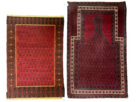 Afghan Baluch red ground prayer rug (144cm x 87cm); with another similar (120cm x 84cm) (2)