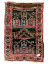 Baluchi dark indigo and crimson ground rug