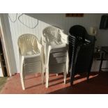 27 White plastic stacking chairs and 15 charcoal stacking chairs