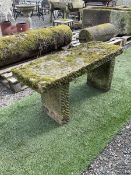 Weathered stone rectangular garden seat bench