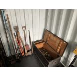 Selection gardening tools and quantity of brass horse cart hub caps and spanners in a wooden trunk