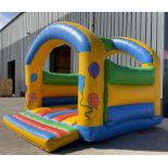 Large inflatable bouncy castle with electric blower