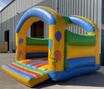 Large inflatable bouncy castle with electric blower