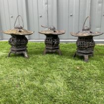 Three cast iron garden lanterns