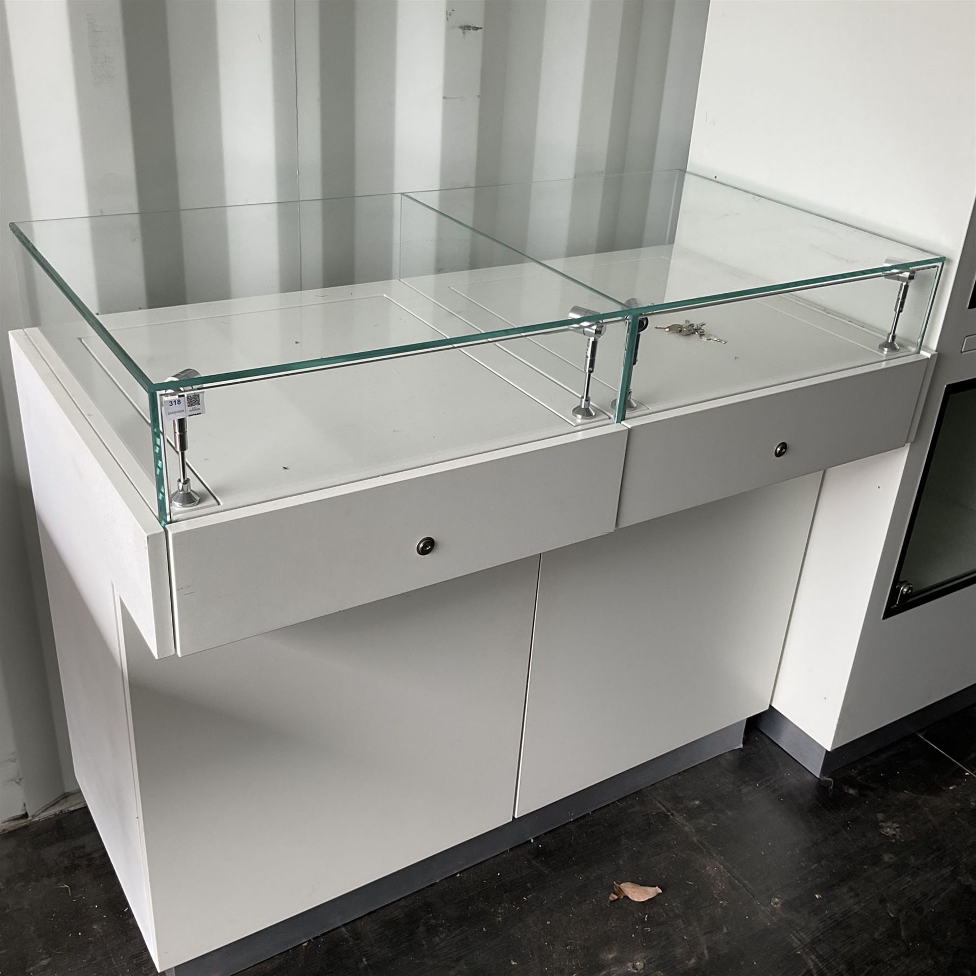 Glass display cabinet with lights and pull out display drawers