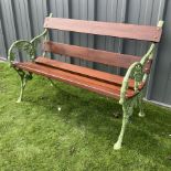 Green painted cast iron and wood slate bench decorated in grapevine