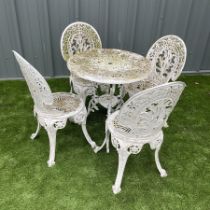 Cast aluminium circular garden table and four chairs