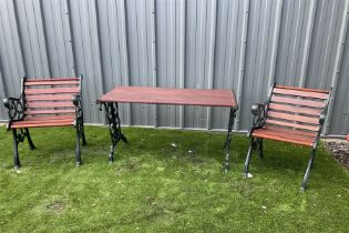 Painted cast iron and wood slated table and two chairs