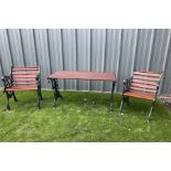 Painted cast iron and wood slated table and two chairs