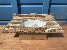 Marble and glazed bathroom sink with chrome pop up drain