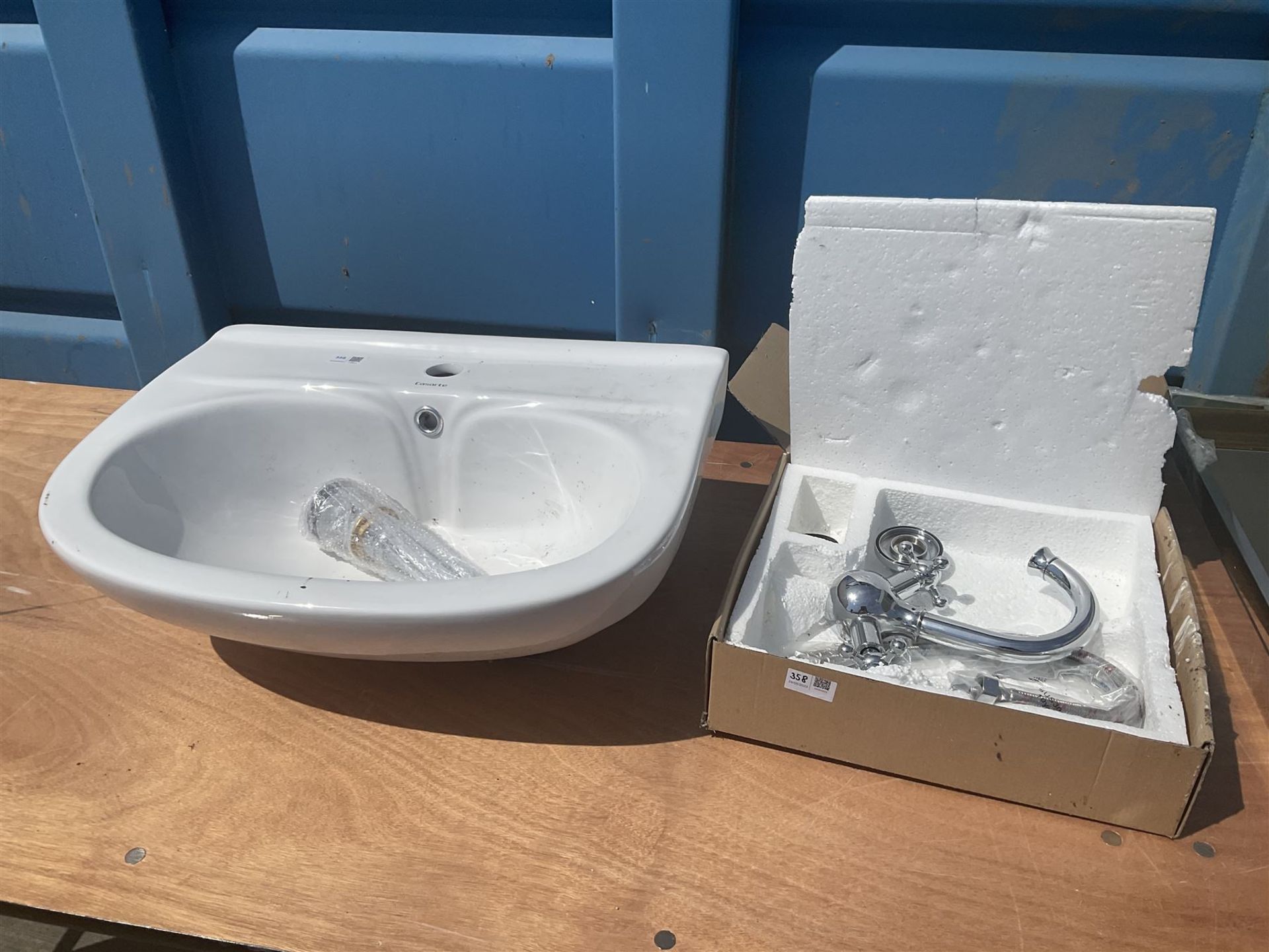 White glazed Casarte sink with chrome mixer tap and pop up drain