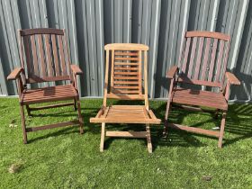Two teak folding garden armchairs and folding lounger