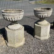Pair of cast stone classic garden urns on hexagonal pedestal base with plinth - THIS LOT IS TO BE CO