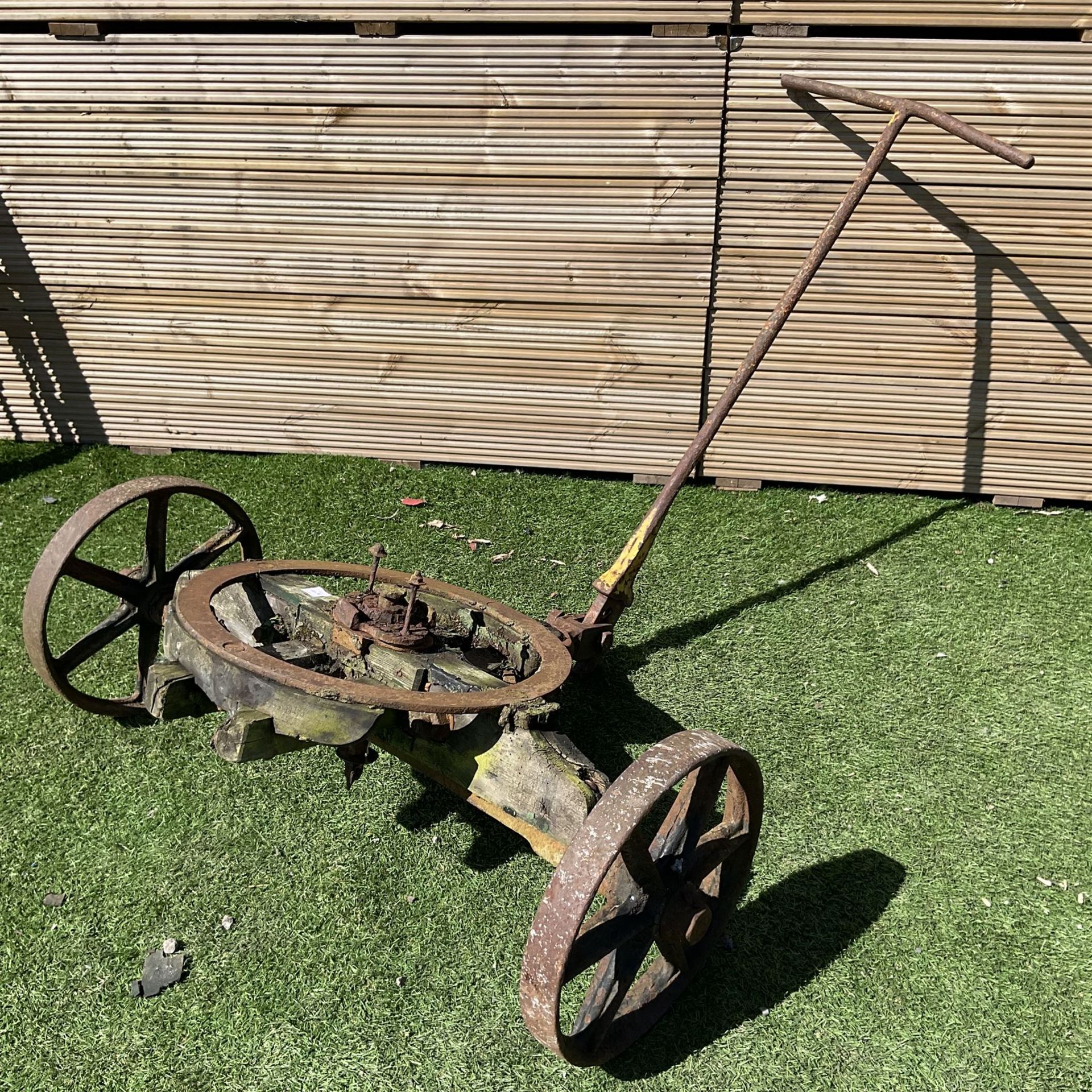 Vintage wooden and cast iron implement - THIS LOT IS TO BE COLLECTED BY APPOINTMENT FROM DUGGLEBY ST