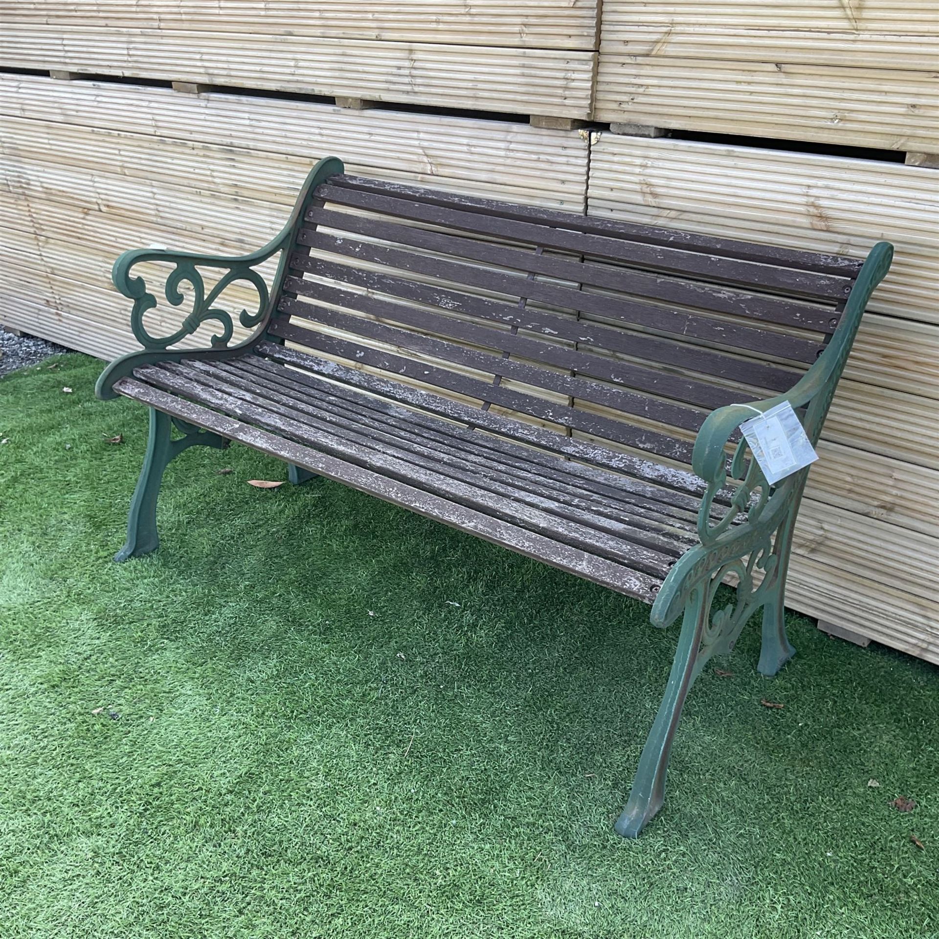 Cast iron and wood slated garden bench painted in green and brown - THIS LOT IS TO BE COLLECTED BY