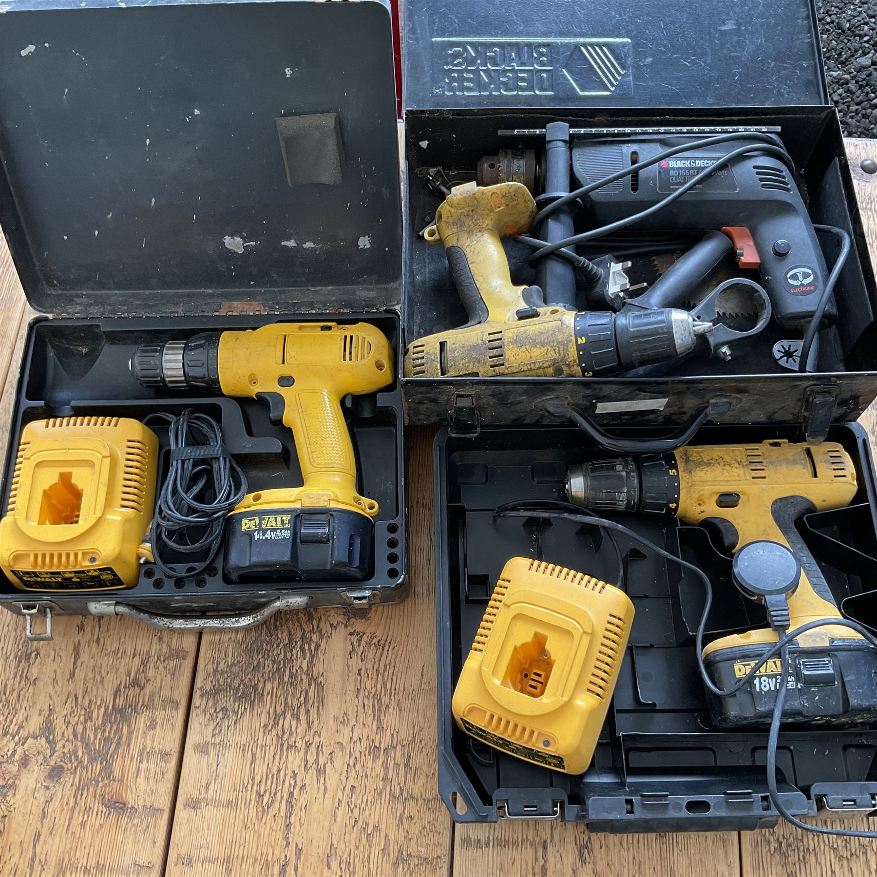 Three DeWalt battery drills with batteries and charger and black and decker corded drill - THIS LOT