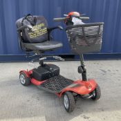 Four wheel electric mobility scooter in orange with keys and charger - THIS LOT IS TO BE COLLECTED