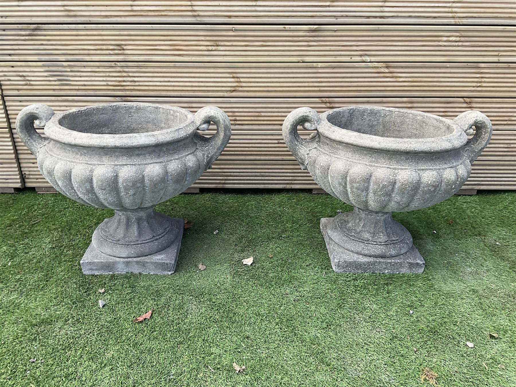 Pair of squat cast stone garden urns
