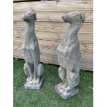 Pair of cast stone seated greyhounds