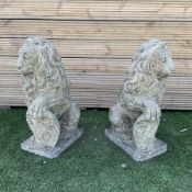 Pair of cast stone seated lions