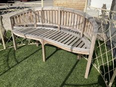 Teak curved serpentine bench - THIS LOT IS TO BE COLLECTED BY APPOINTMENT FROM DUGGLEBY STORAGE