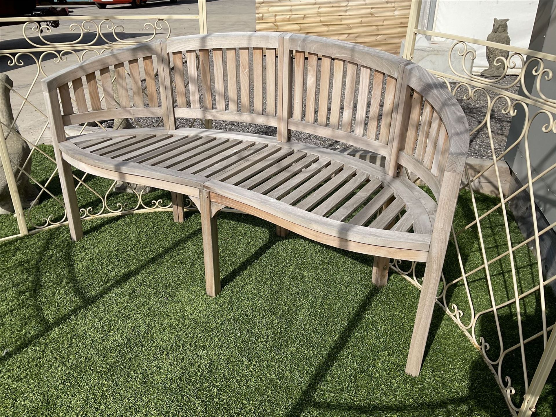 Teak curved serpentine bench - THIS LOT IS TO BE COLLECTED BY APPOINTMENT FROM DUGGLEBY STORAGE