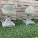 Pair of cast stone garden spherical ball finials or gatepost tops