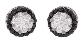 Pair of 18ct white gold black and white diamond circular stud earrings