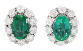 18ct white gold oval cut emerald and round brilliant cut diamond cluster stud earrings