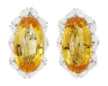 Pair of 18ct white gold oval cut citrine and marquise cut diamond cluster clip on earrings