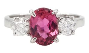 18ct white gold three stone oval cut pink tourmaline and round brilliant cut diamond ring