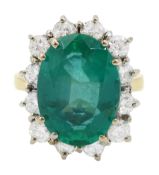18ct gold oval cut emerald and round brilliant cut diamond cluster ring