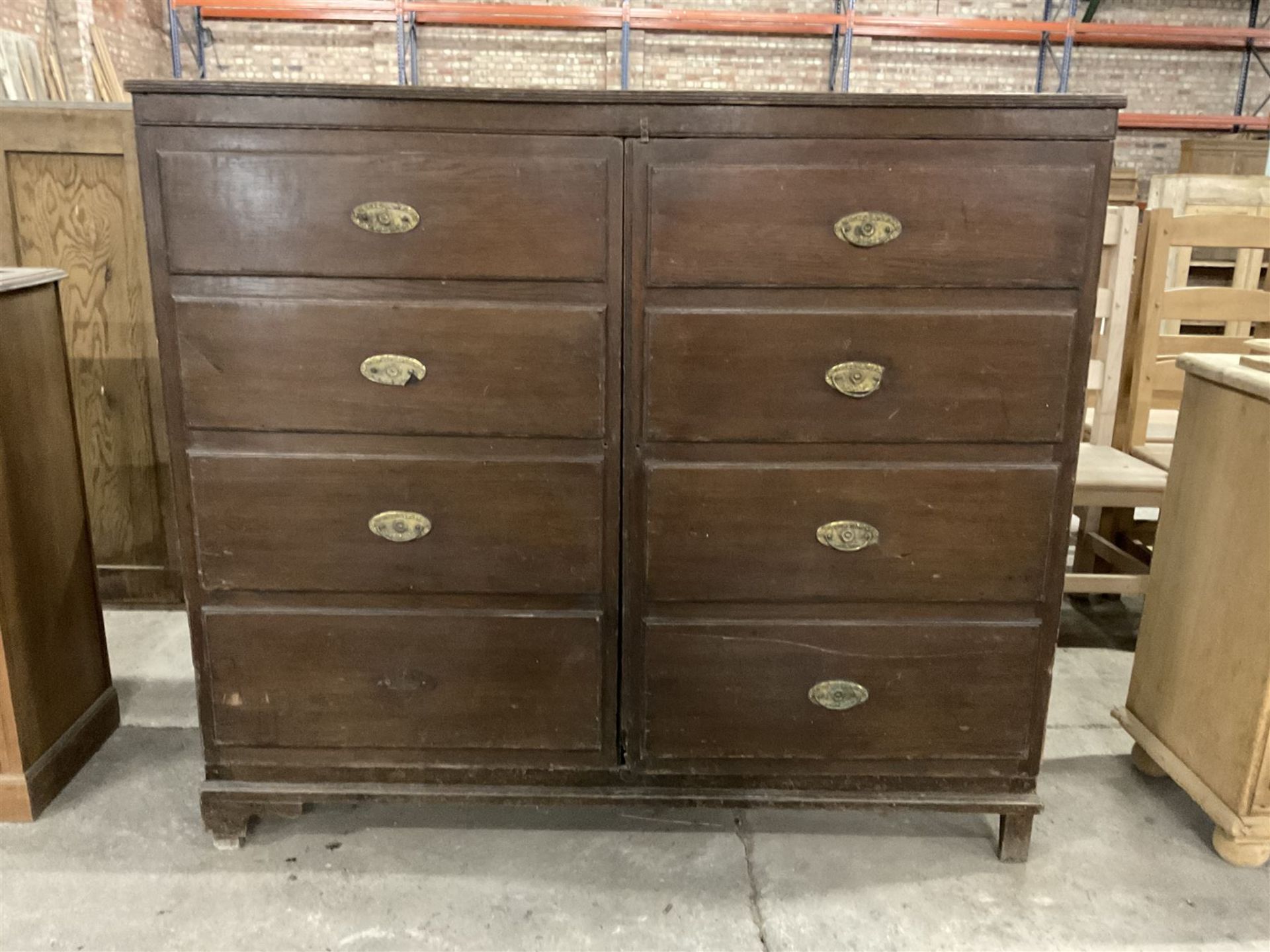 Early 20th century oak cupboard disguised as a chest of eight drawers