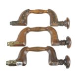 A brass plated beech brace and two brass button pad braces G+