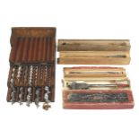 An auger box containing a marriage of 13 bits and 4 expansive bits in orig boxes G