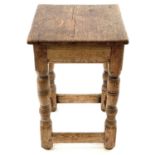 An oak square occasional table.