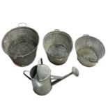 Three tin baths and a galvanised watering can.
