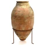 A terracotta olive storage jar.