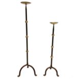 Two wrought iron pricket candleholders in sizes.