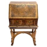 A Queen Anne style burr yew and elm banded small writing bureau.