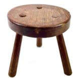 An oak milking stool.