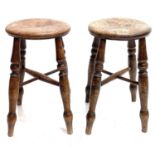 Two Victorian elm circular top stools.