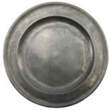 A large 18th century circular pewter charger.